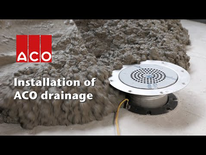 ACO stainless steel commercial gully installed with vinyl fl