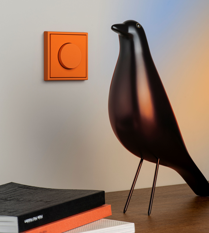 jung gaismas rotācijas dimmers oranžā krāsā